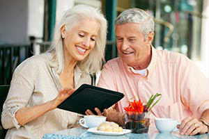 Senior Citizens Utilize Bible App On Tablet senior-couple-using-bible-app-on-tablet